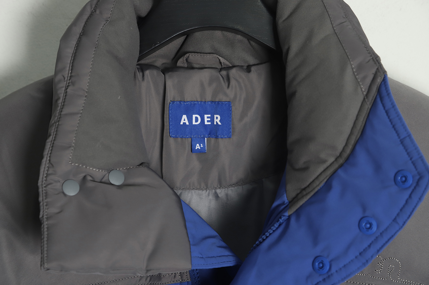 ADER 22Fw Contrast color asymmetric down jacket