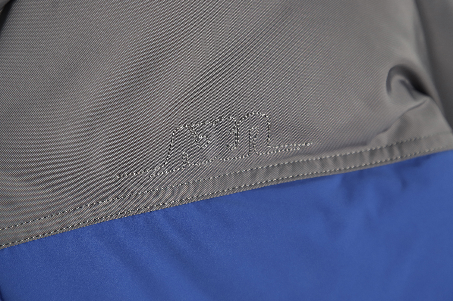 ADER 22Fw Contrast color asymmetric down jacket