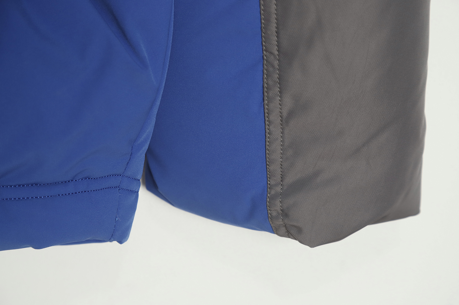 ADER 22Fw Contrast color asymmetric down jacket