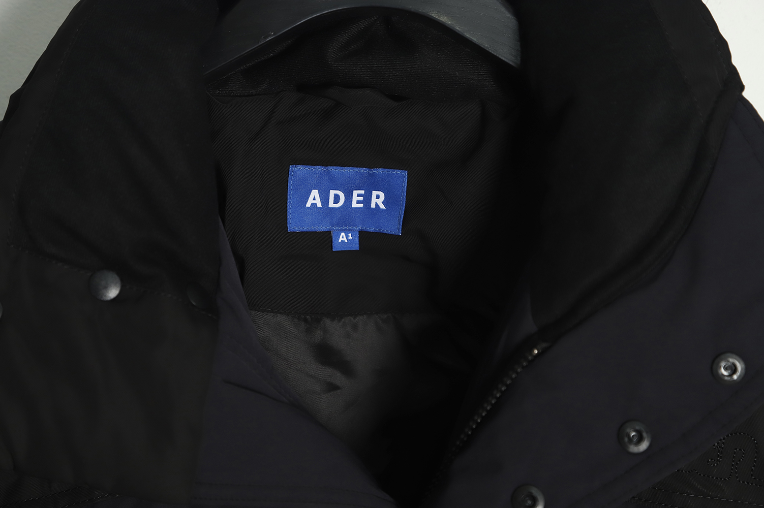 ADER 22Fw Contrast color asymmetric down jacket TSK1t
