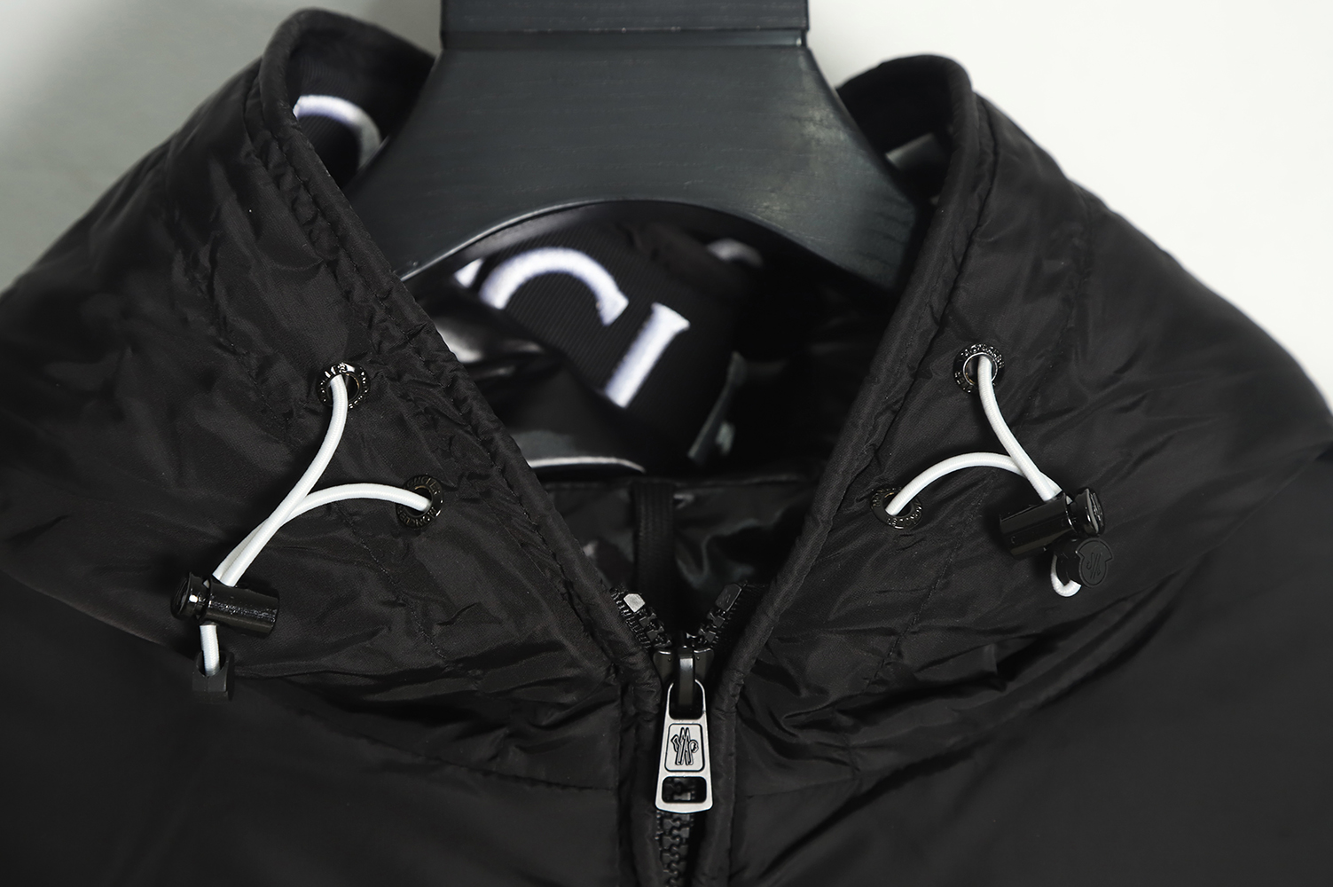 Moncler logo embroidered down jacket