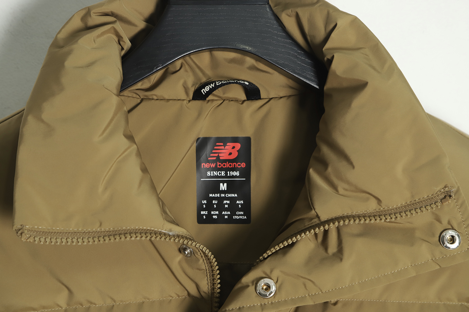 New Balance solid color down jacket with large pockets