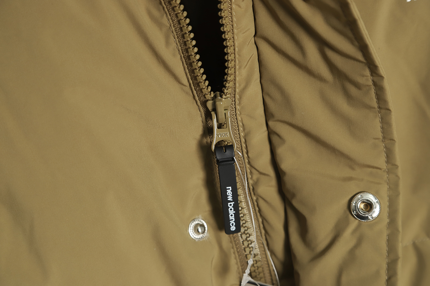 New Balance solid color down jacket with large pockets