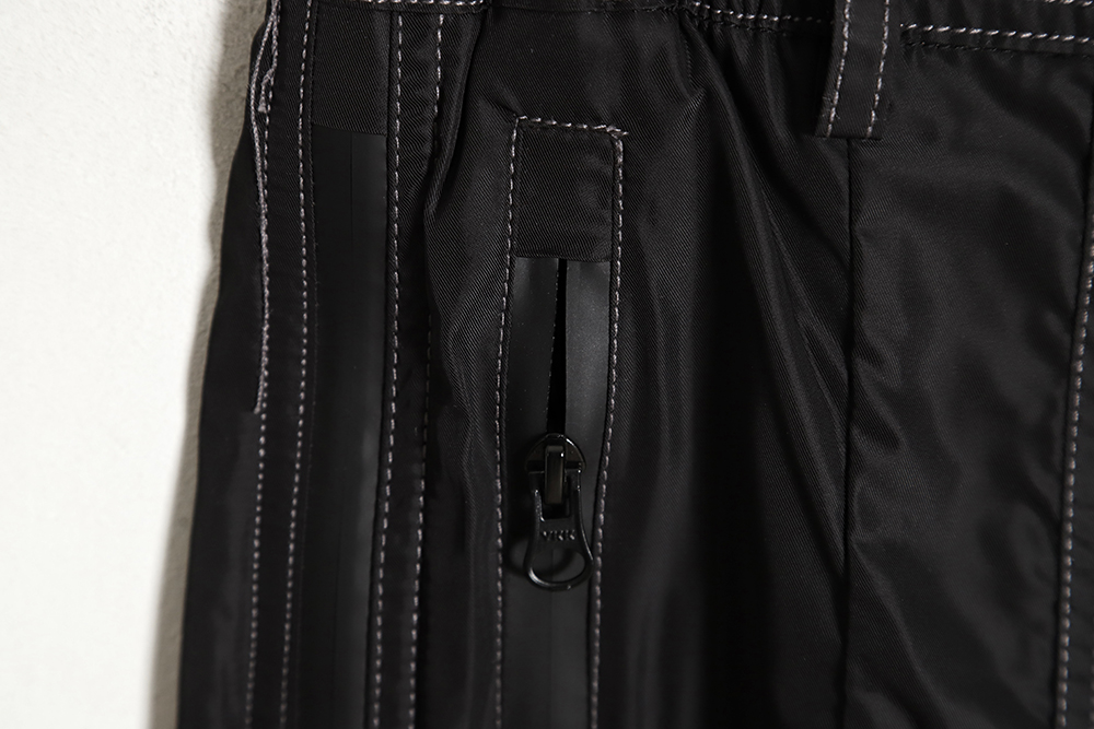 Far archive laminated zip trousers