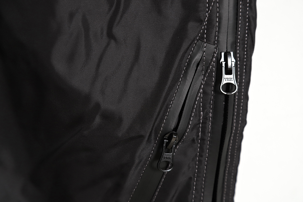 Far archive laminated zip trousers