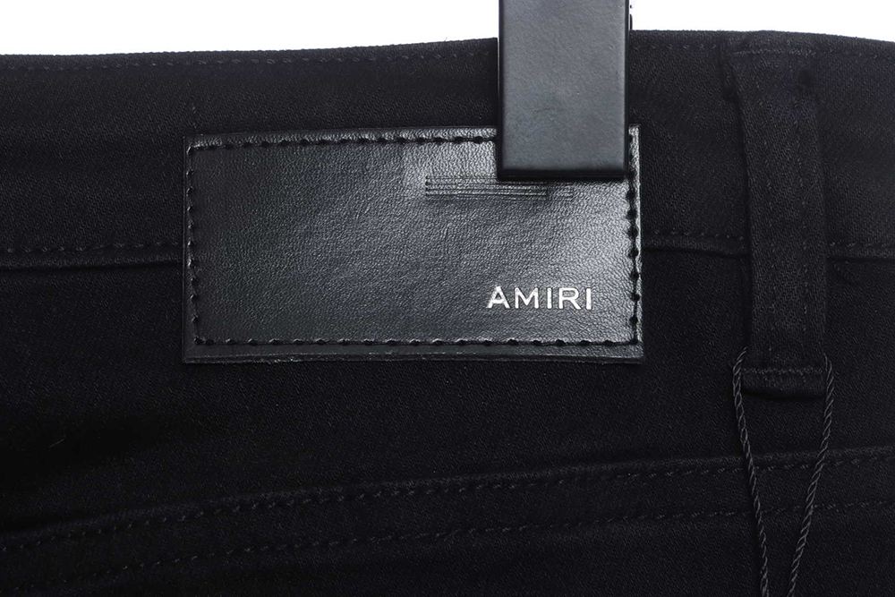 AMIRI MX1 zip-up washed stretch-denim trousers