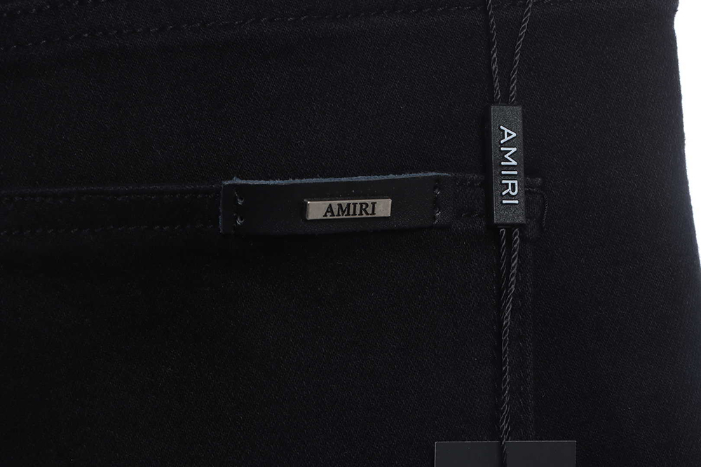 AMIRI MX1 zip-up washed stretch-denim trousers