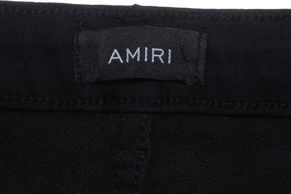 AMIRI MX1 zip-up washed stretch-denim trousers
