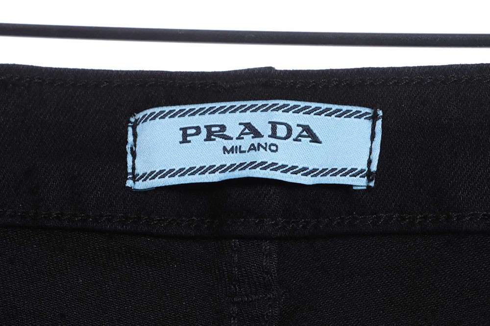 Prada triangle denim trousers