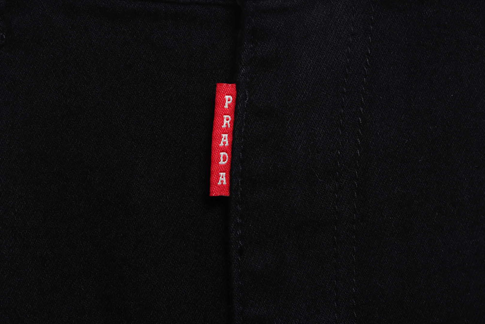 Prada triangle denim trousers