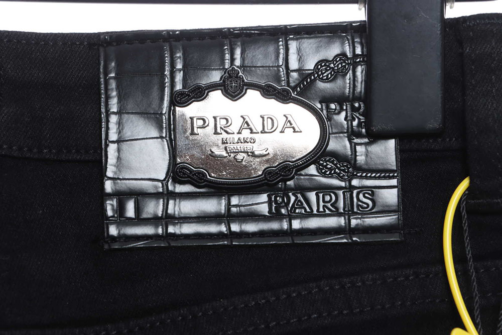 Prada triangle denim trousers