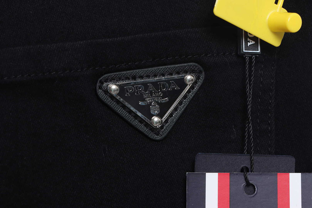 Prada triangle denim trousers