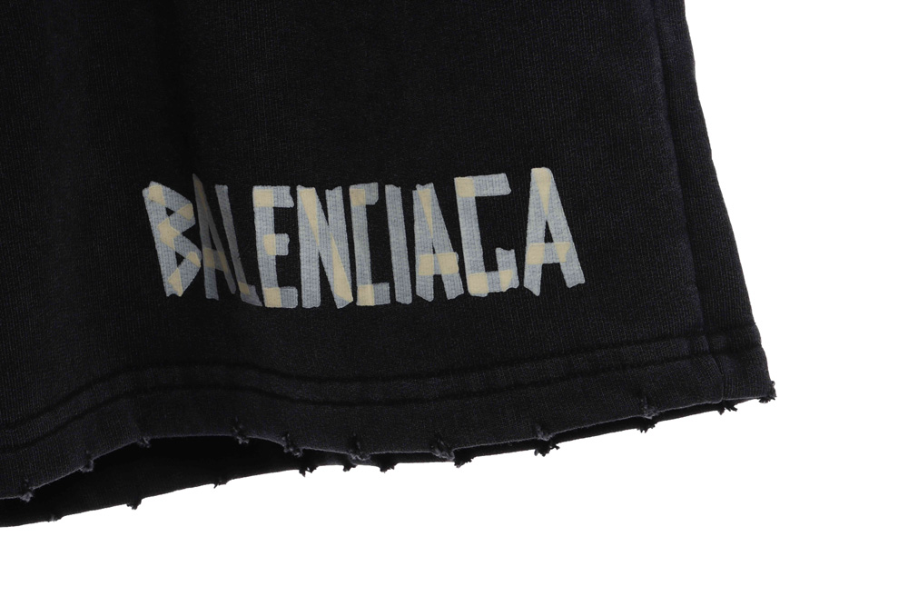 Balenciaga tape-print ripped shorts