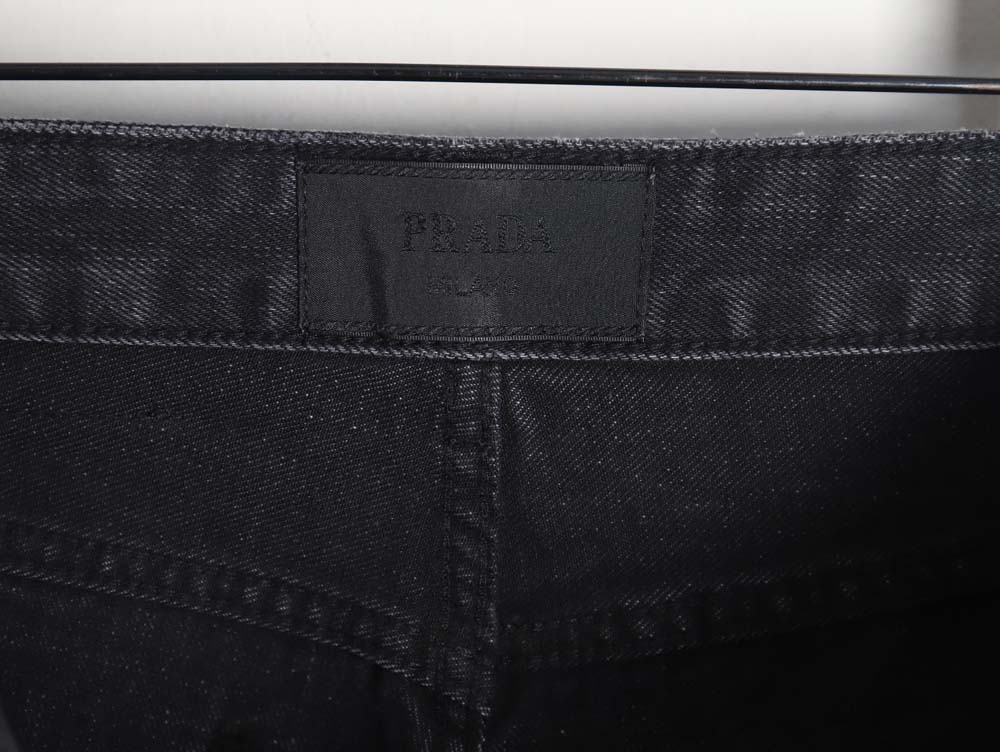 Prada 23Fw triangle logo and logo embroidered washed jeans
