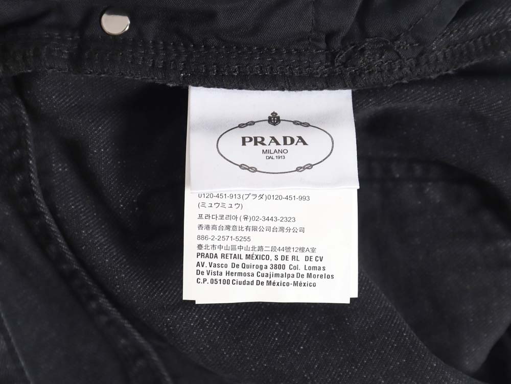 Prada 23Fw triangle logo and logo embroidered washed jeans