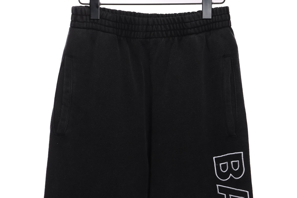 Balenciaga distressed washed monogram trousers