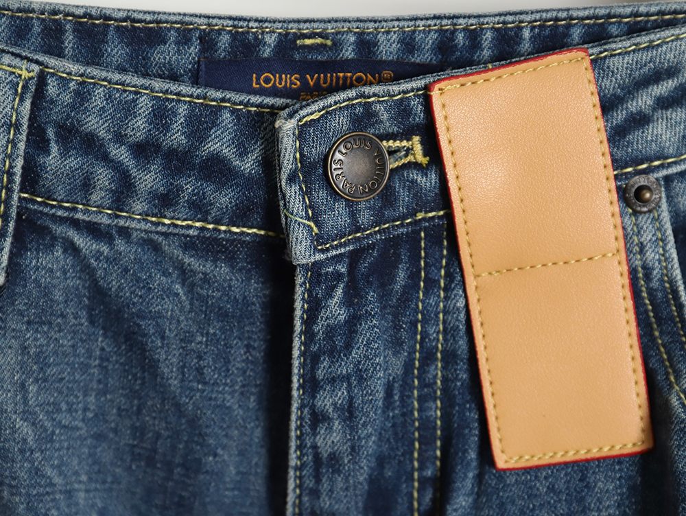 Louis Vuitton monogram leather logo flared denim trousers