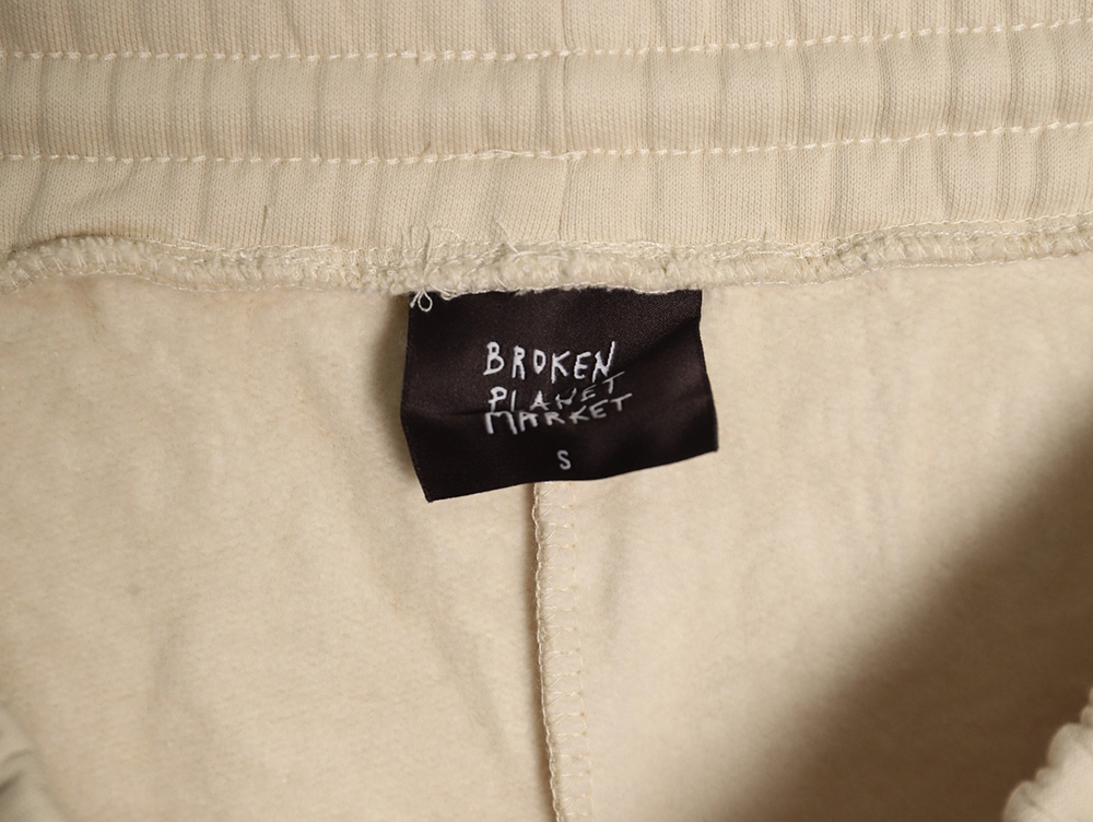 Broken Planet Market lettering trousers TSK1