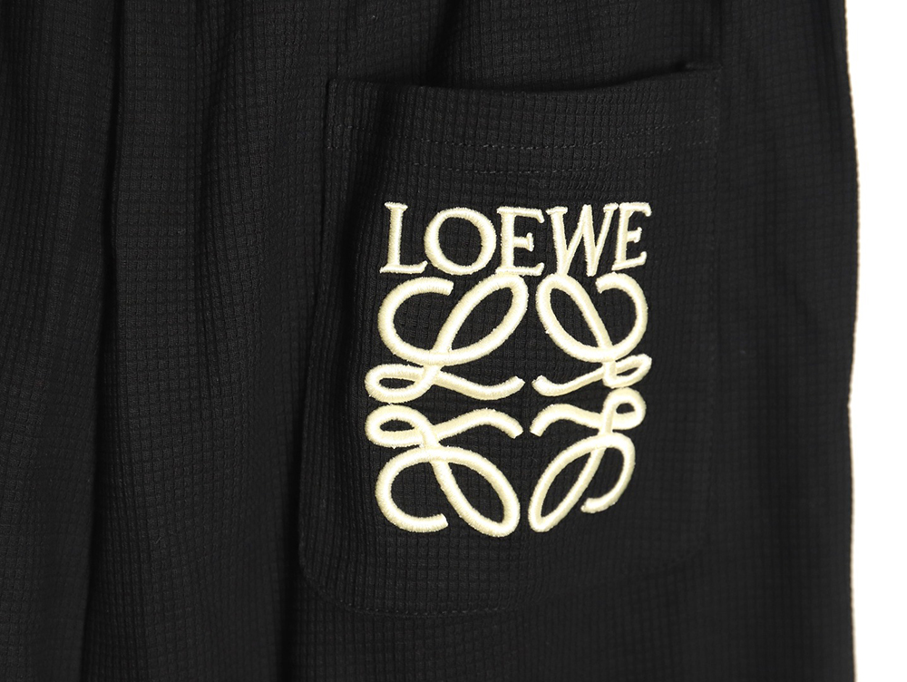 Loewe embroidered logo waffle trousers TSK1