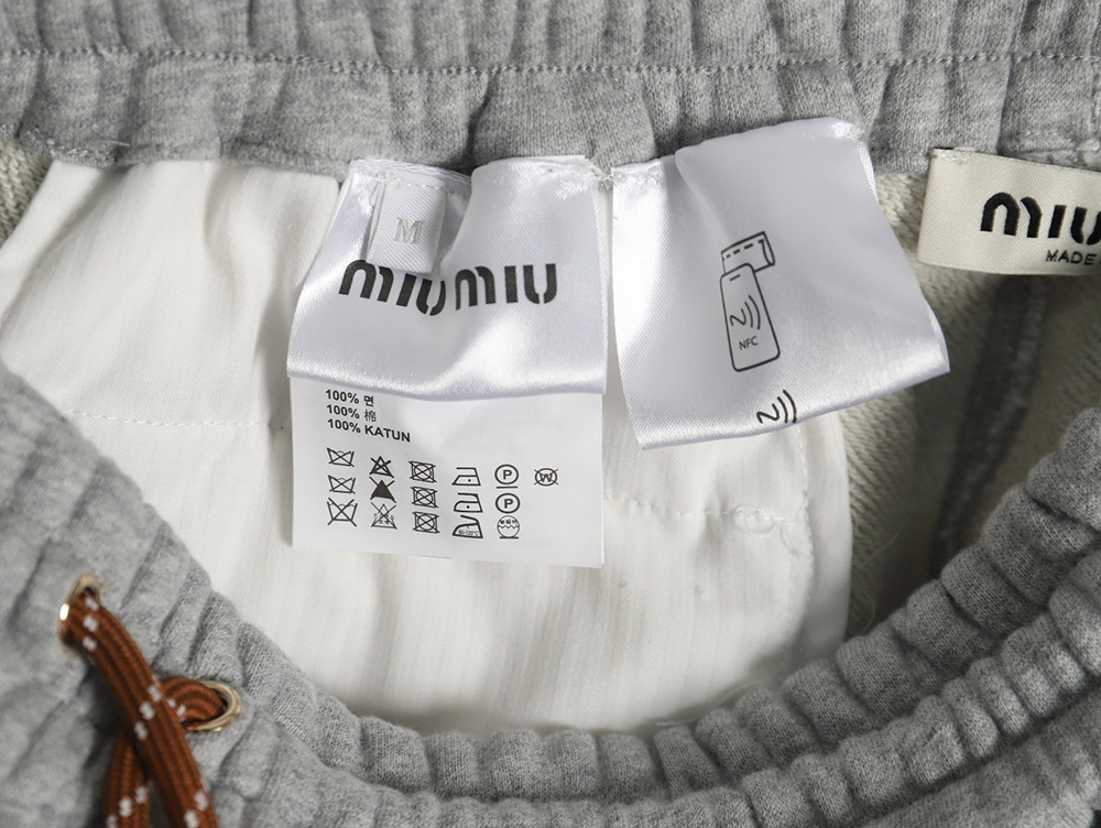 Miu Miu patch lettering raw hem shorts