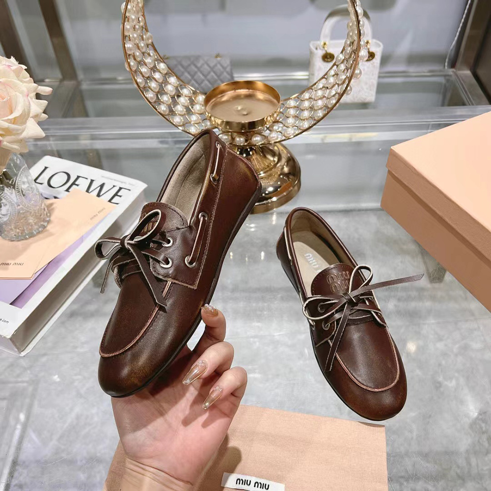 Miu Miu bleached leather loafers
