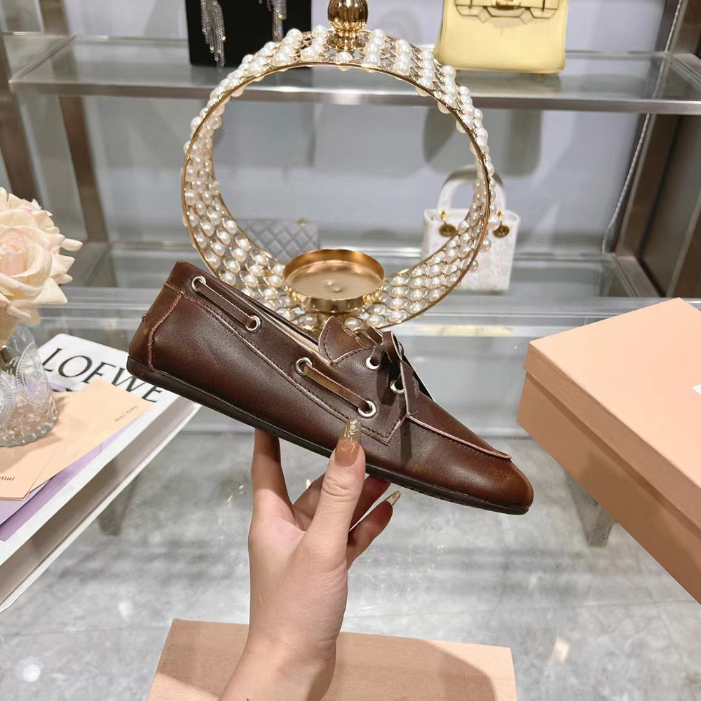 Miu Miu bleached leather loafers