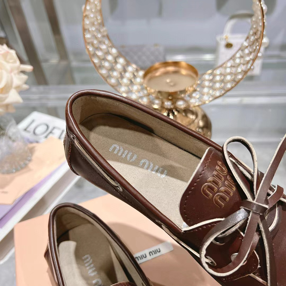 Miu Miu bleached leather loafers