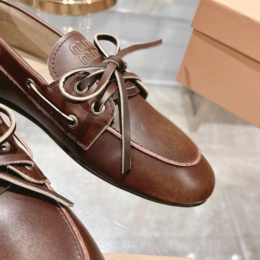 Miu Miu bleached leather loafers