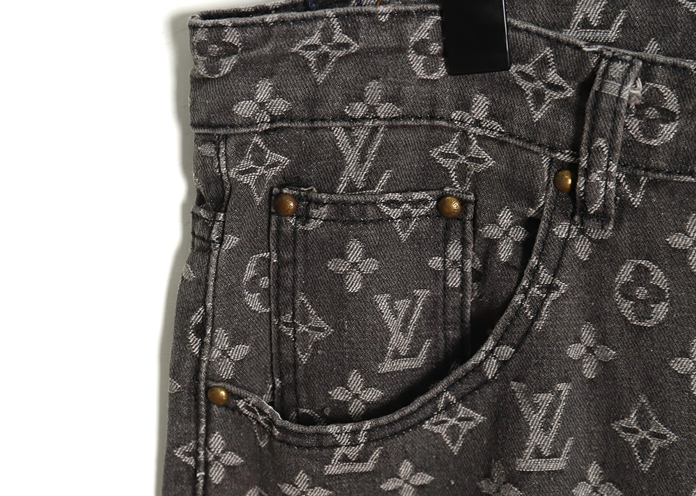 Louis Vuitton printed distressed denim trousers
