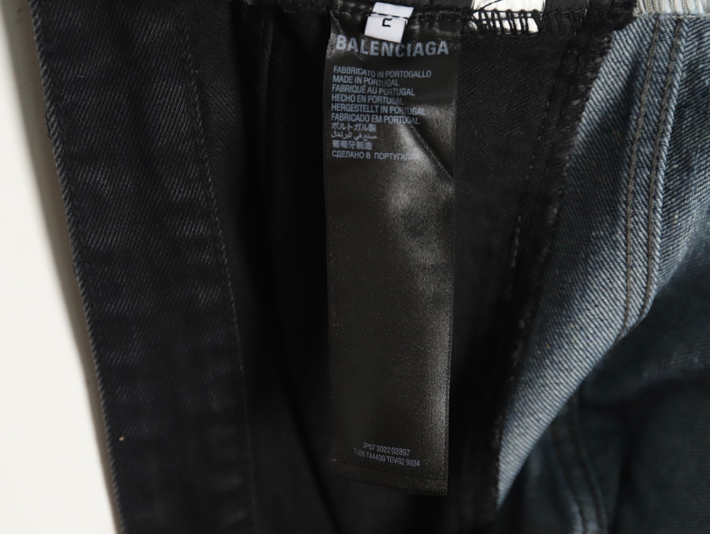 Balenciaga black and blue patchwork ripped denim trousers