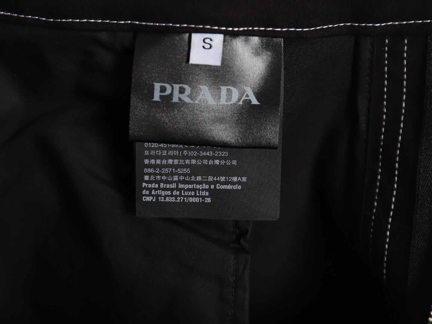 Prada triangle logo white line denim trousers