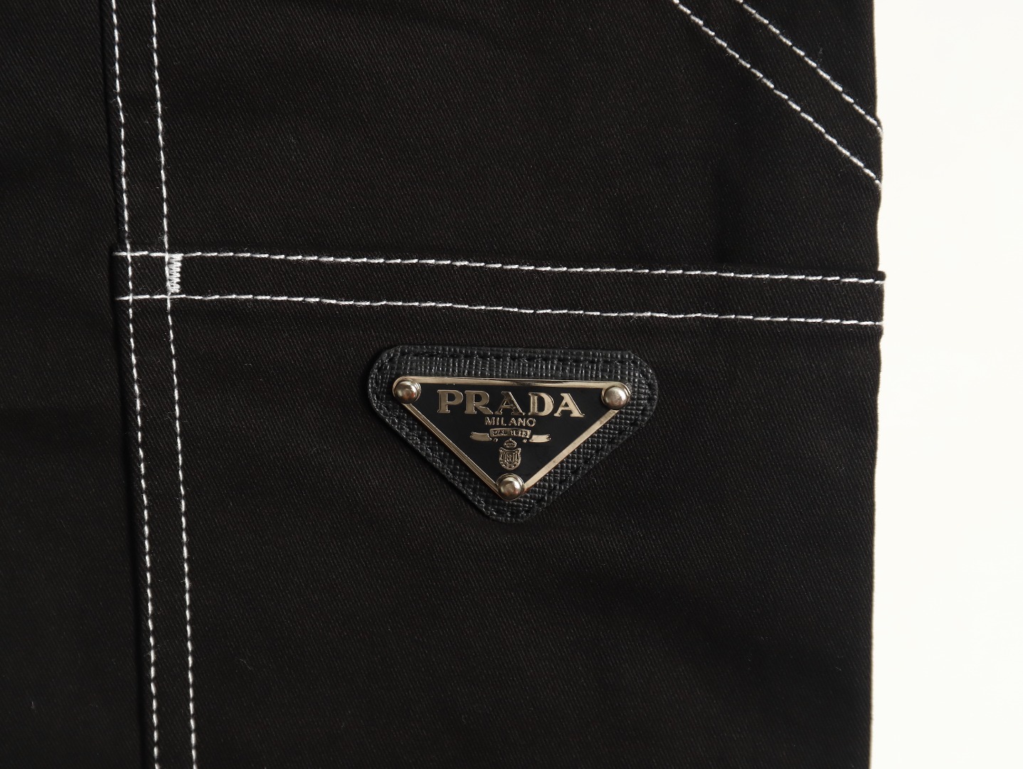 Prada triangle logo white line denim trousers