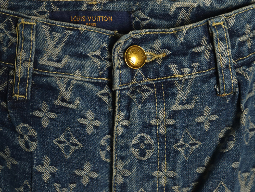 Louis Vuitton washed blue jeans with all-over print and side straps