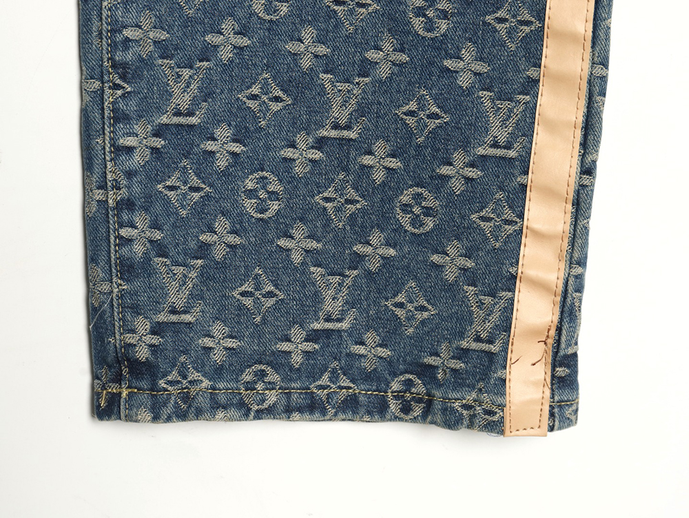 Louis Vuitton washed blue jeans with all-over print and side straps