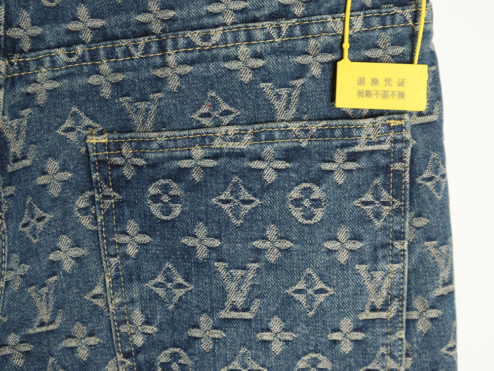 Louis Vuitton washed blue jeans with all-over print and side straps