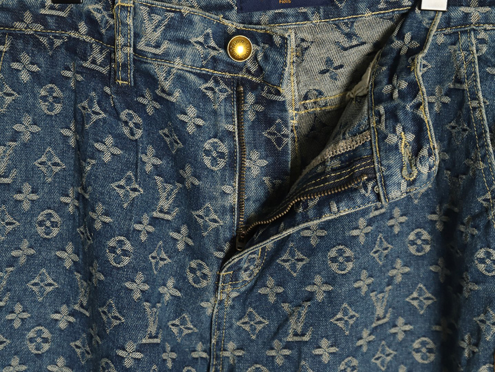 Louis Vuitton washed blue jeans with all-over print and side straps