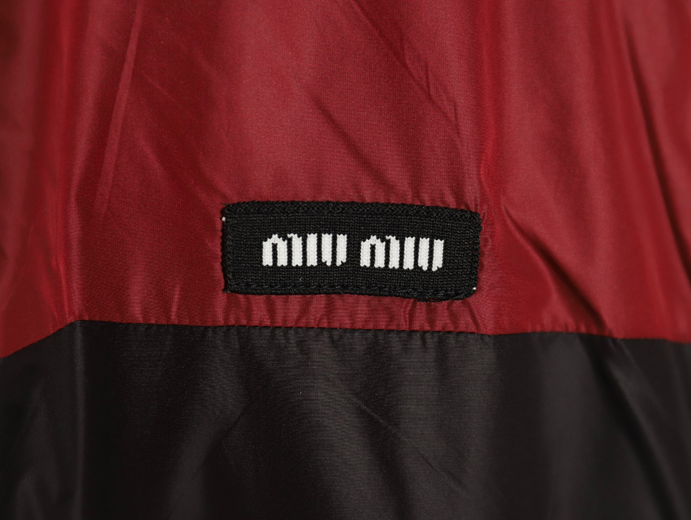 Miu Miu patchwork lettering trench coat