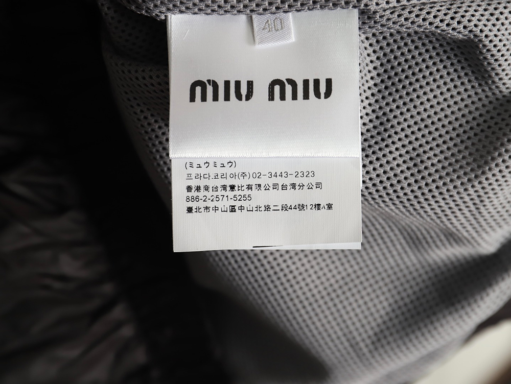 Miu Miu patchwork lettering trench coat