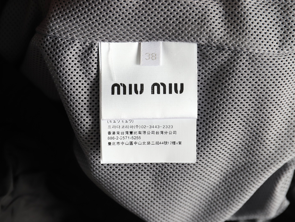 Miu Miu patchwork lettering trench coat TSK1