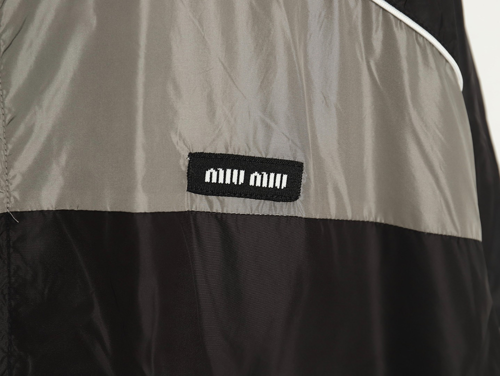 Miu Miu patchwork lettering trench coat TSK1