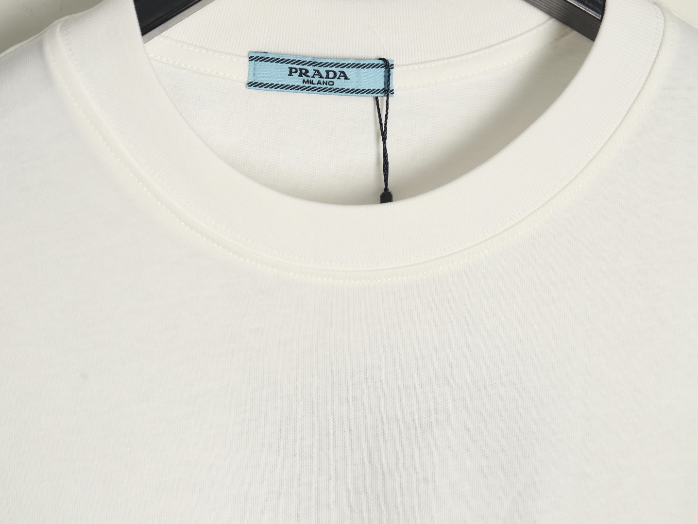 Prada triangle logo leather tag pocket short sleeves