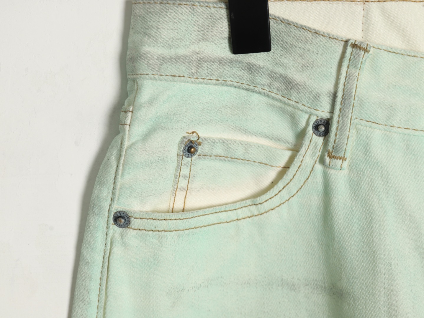 Acne studios irregular distressed handmade glow-in-the-dark jeans