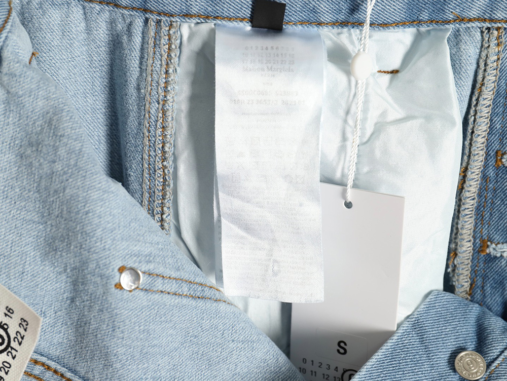 Maison Margiela distressed graffiti denim trousers