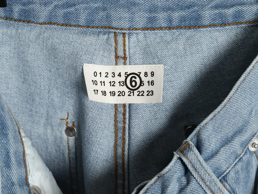Maison Margiela distressed graffiti denim trousers